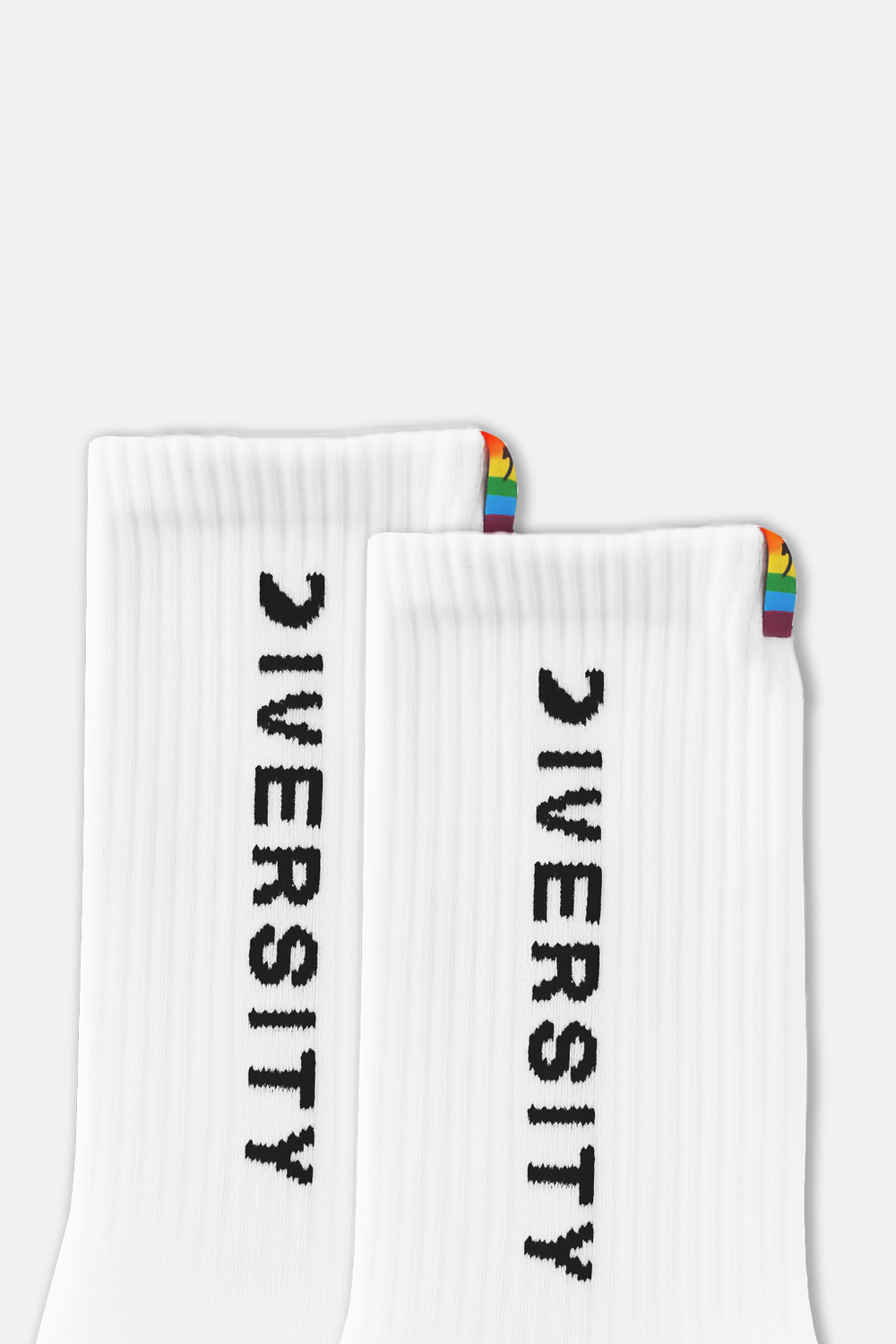 Close-up of the DIVERSITY logo and rainbow tag on the white socks