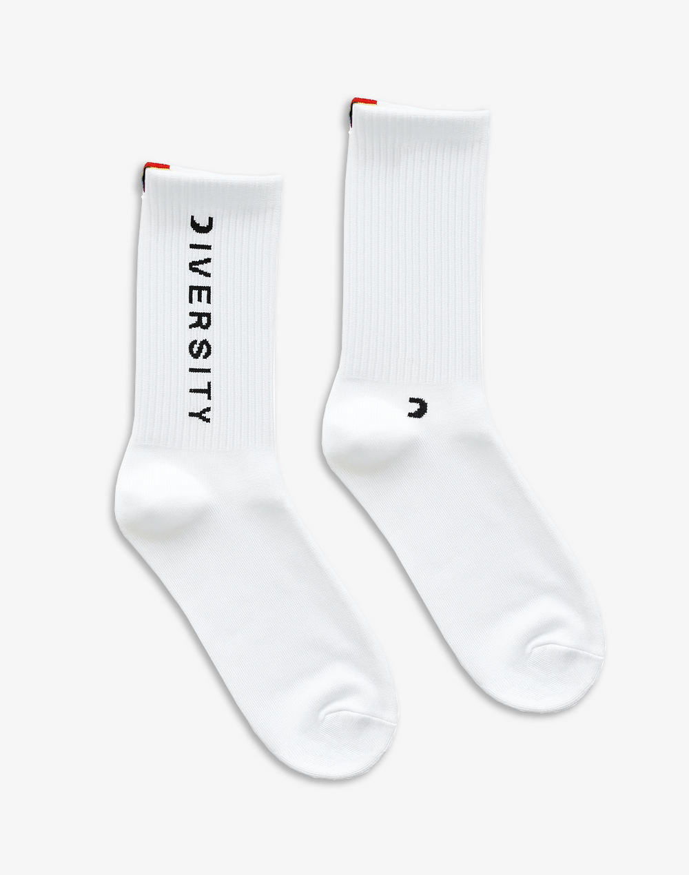 Pair of white Diversity socks laid flat, DIVERSITY logo and rainbow tag