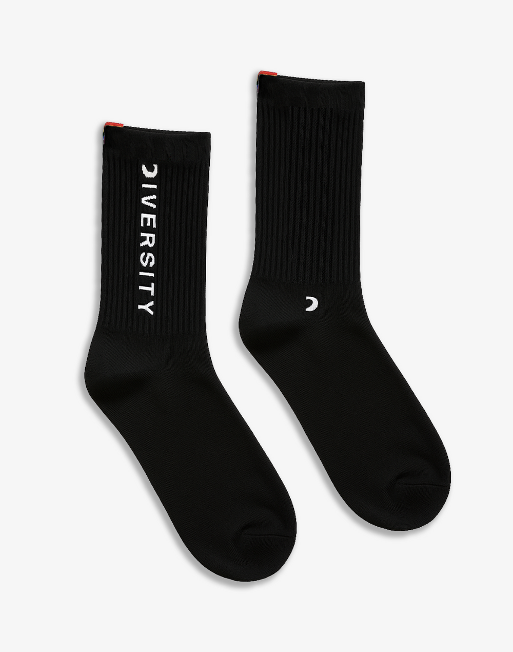 Pair of black Diversity socks laid flat, DIVERSITY logo and rainbow tag