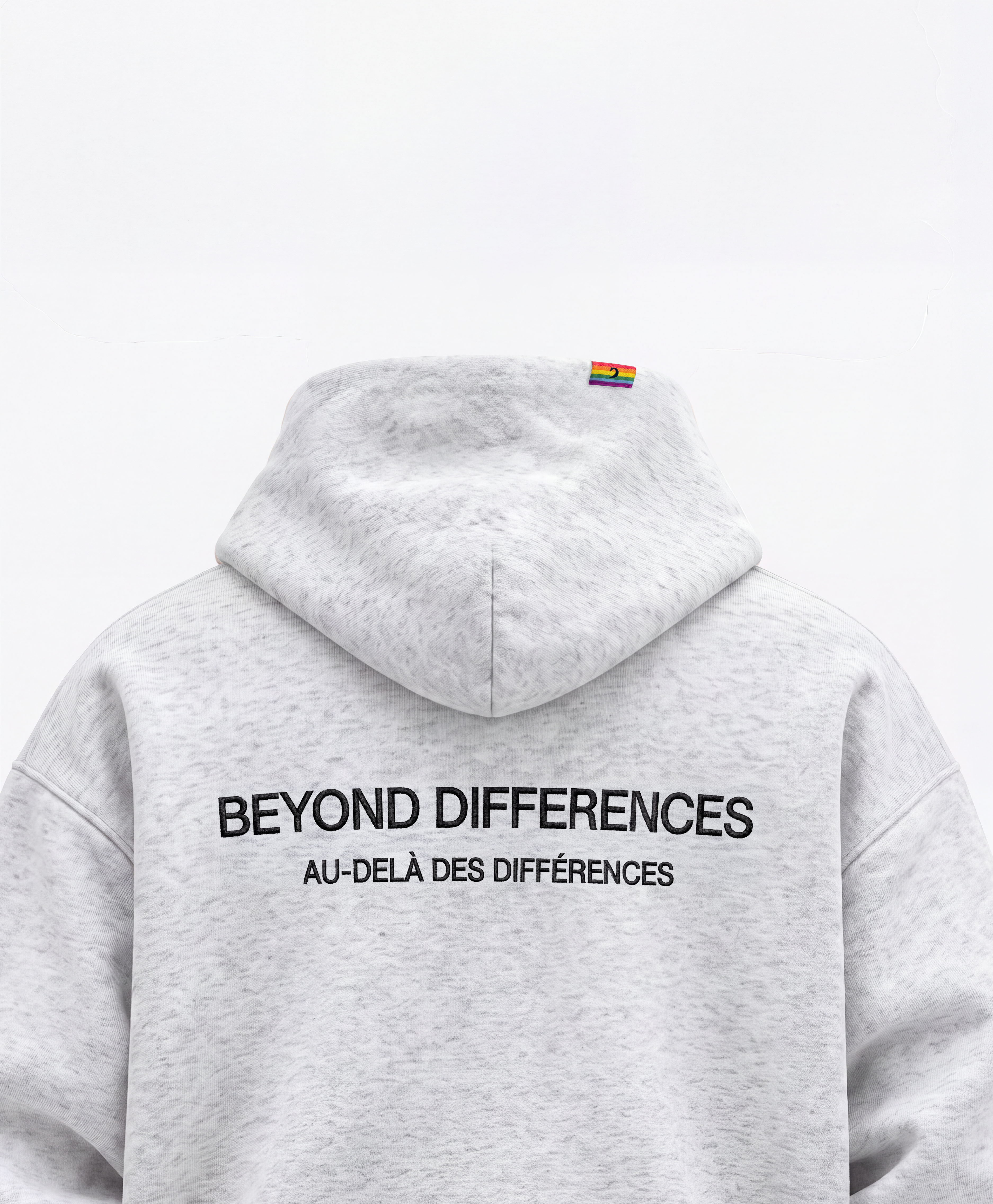 Back of the grey Heavyweight Hoodie: black BEYOND DIFFERENCES / AU-DELÀ DES DIFFÉRENCES embroidery