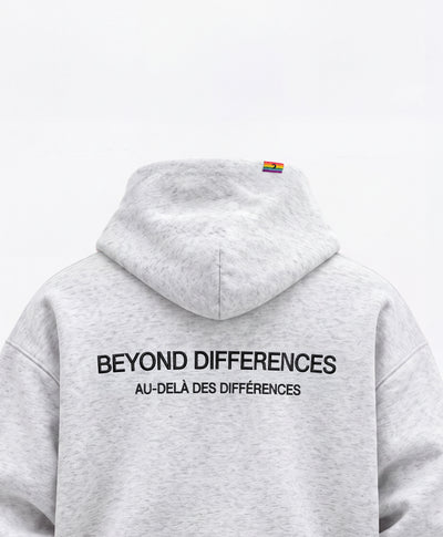 Back of the grey Heavyweight Hoodie: black BEYOND DIFFERENCES / AU-DELÀ DES DIFFÉRENCES embroidery