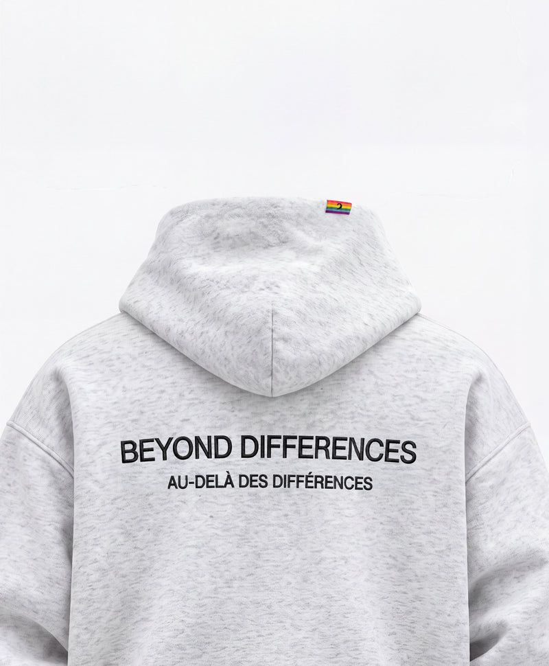 Dos du Heavyweight Hoodie Gris : broderie noire BEYOND DIFFERENCES / AU-DELÀ DES DIFFÉRENCES