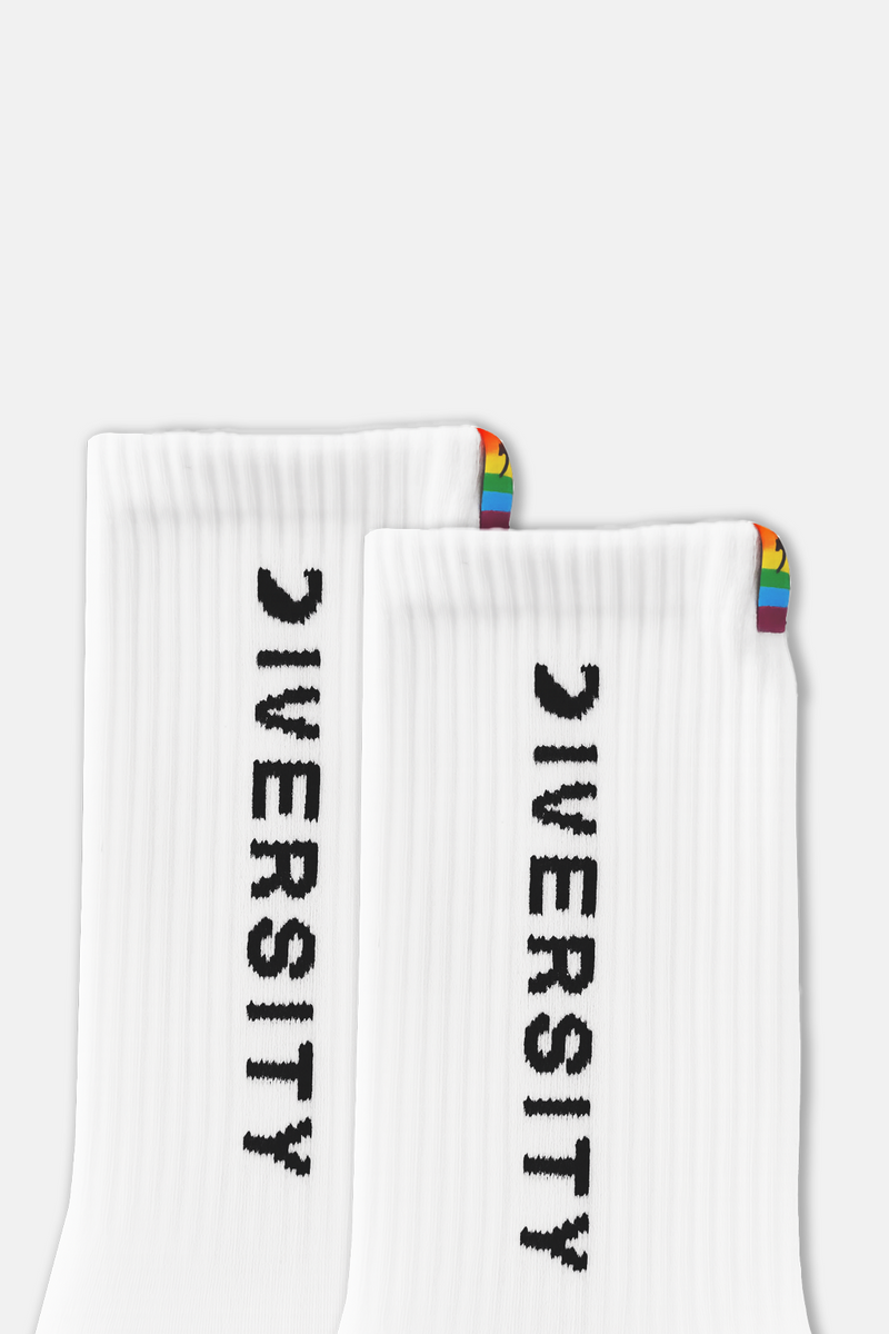 Close-up of the DIVERSITY logo and rainbow tag on the white socks