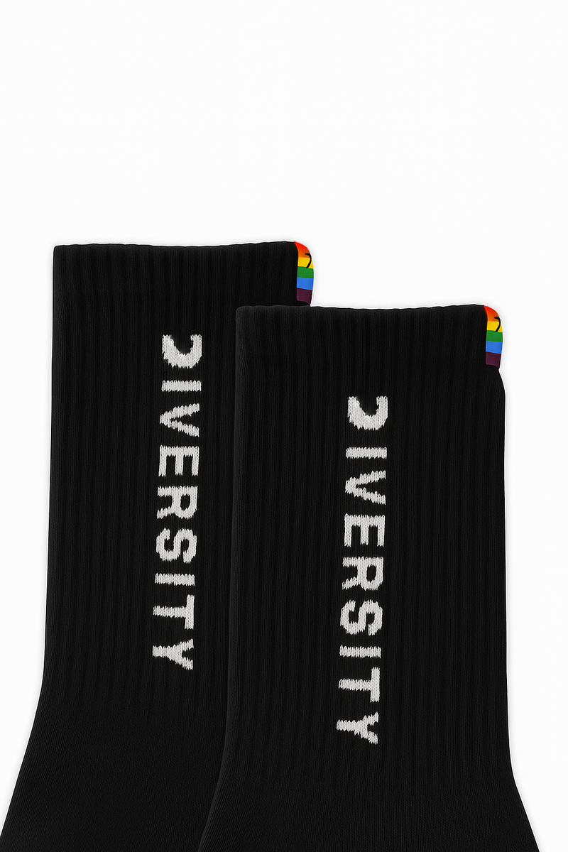 Close-up of the DIVERSITY logo and rainbow tag on the black socks