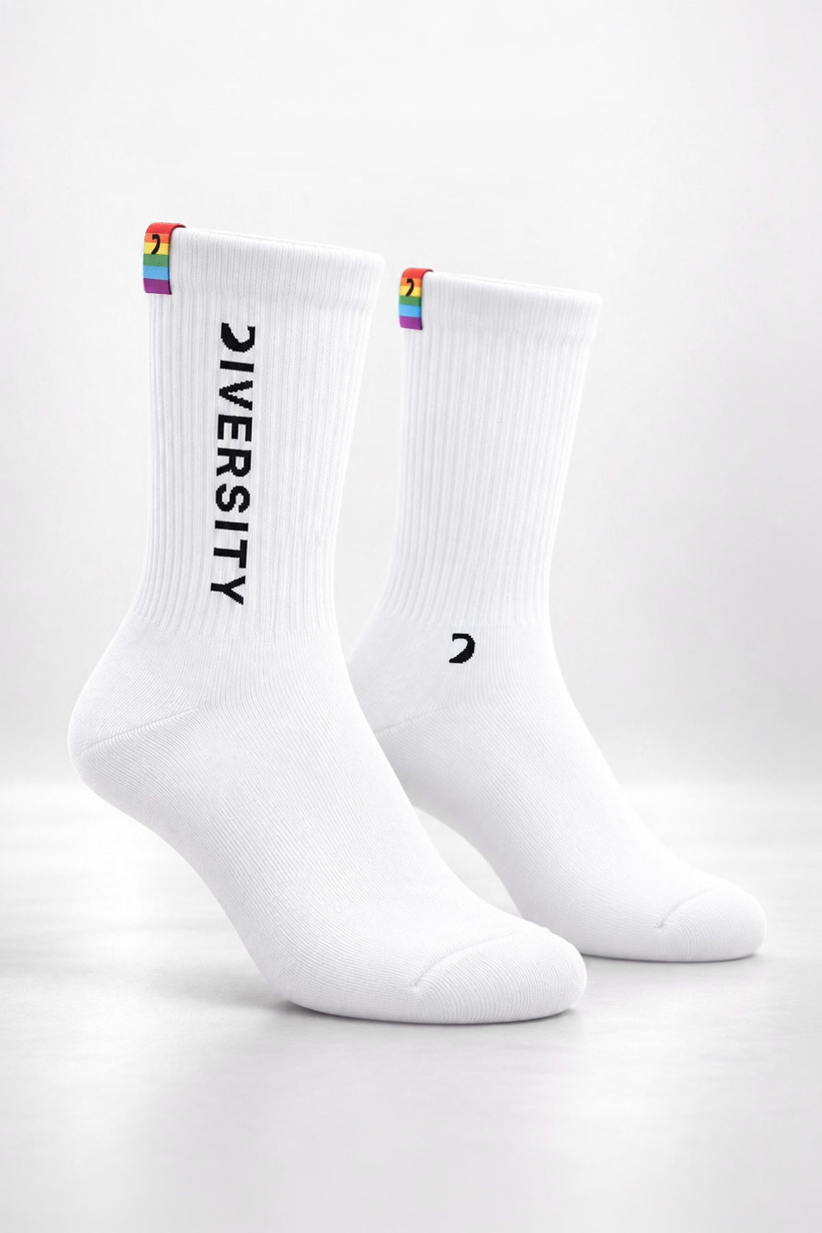 White unisex Diversity socks, black DIVERSITY logo and rainbow flag tag