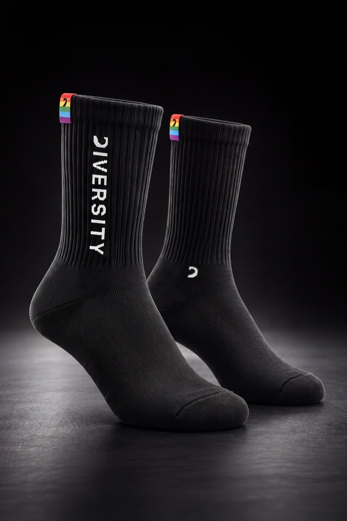Black unisex Diversity socks, white DIVERSITY logo and rainbow flag tag